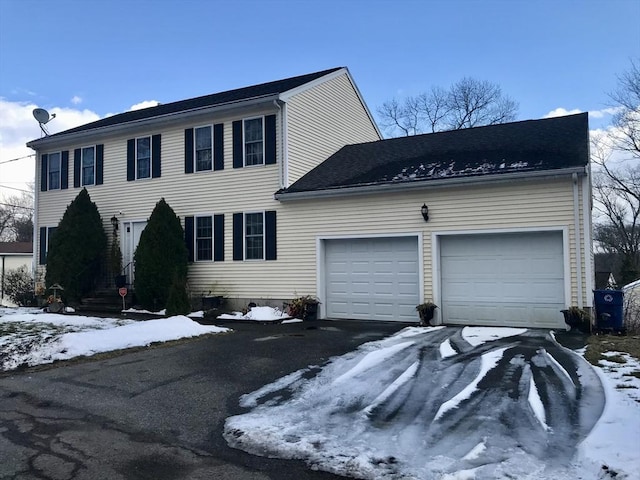 colonial inspired home with a garage