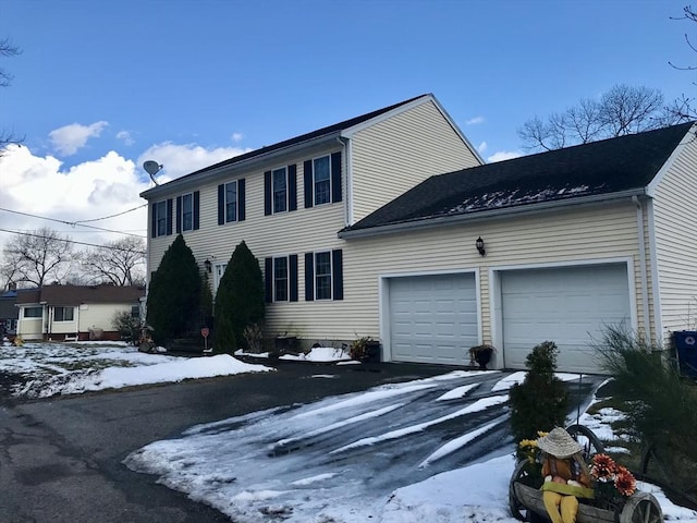 colonial-style house featuring a garage