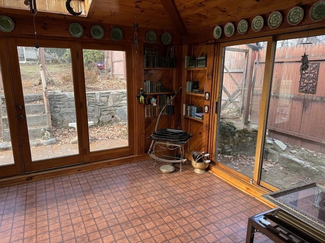 sunroom featuring wood ceiling and lofted ceiling