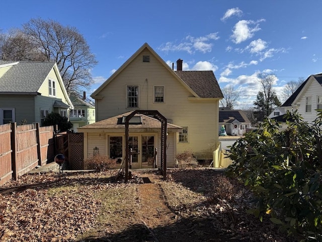 rear view of property with french doors