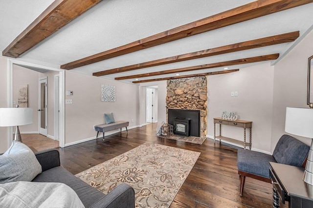 living room with dark wood-style floors, beam ceiling, and baseboards