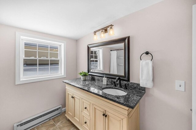 bathroom featuring a baseboard radiator and vanity