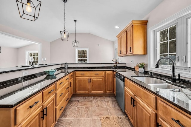 kitchen featuring hanging light fixtures, stainless steel dishwasher, vaulted ceiling, a sink, and dark stone counters