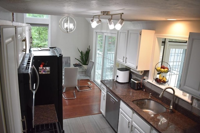 16 Sherborne Cir, Ashland, MA 01721 - kitchen with a sink, dishwasher, dark stone counters, white cabinets, and a chandelier