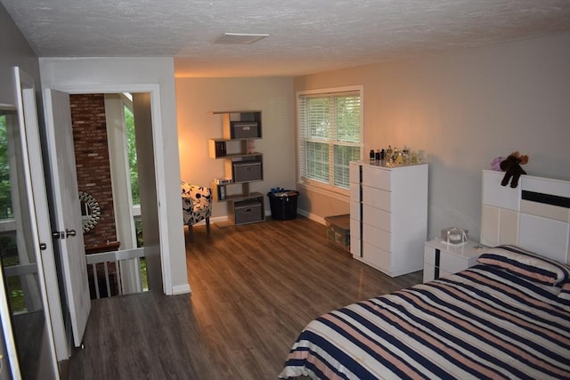 16 Sherborne Cir, Ashland, MA 01721 - bedroom with a textured ceiling, wood finished floors, and baseboards