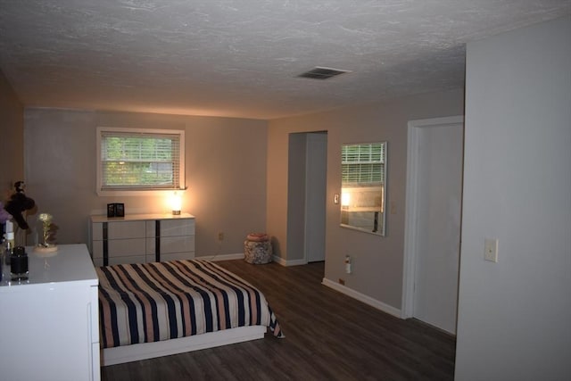 16 Sherborne Cir, Ashland, MA 01721 - bedroom with wood finished floors, baseboards, and a textured ceiling