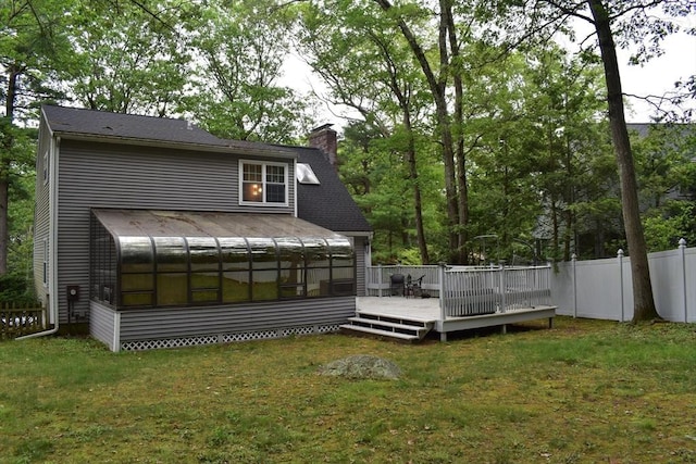 16 Sherborne Cir, Ashland, MA 01721 - rear view of property with a sunroom, a chimney, and a wooden deck