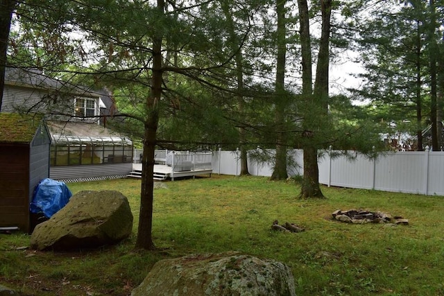 16 Sherborne Cir, Ashland, MA 01721 - view of yard with a wooden deck and a sunroom