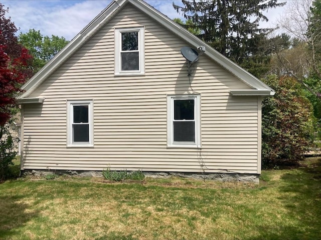 view of home's exterior featuring a lawn