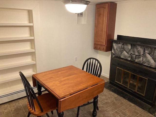 dining space with ornamental molding