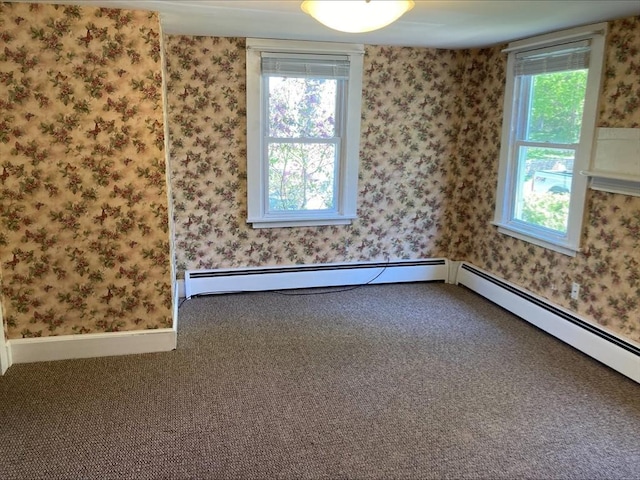 spare room with wallpapered walls, plenty of natural light, and carpet