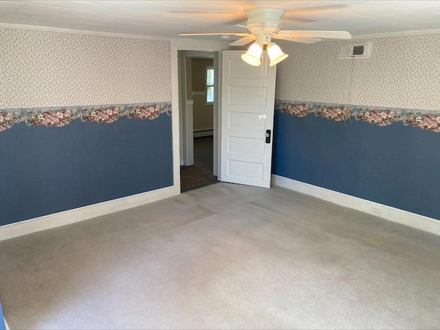 carpeted spare room with a ceiling fan, wallpapered walls, and ornamental molding