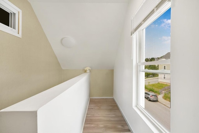 32 Slater St, Fall River, MA 02720 - corridor featuring wood finished floors, an upstairs landing, and vaulted ceiling