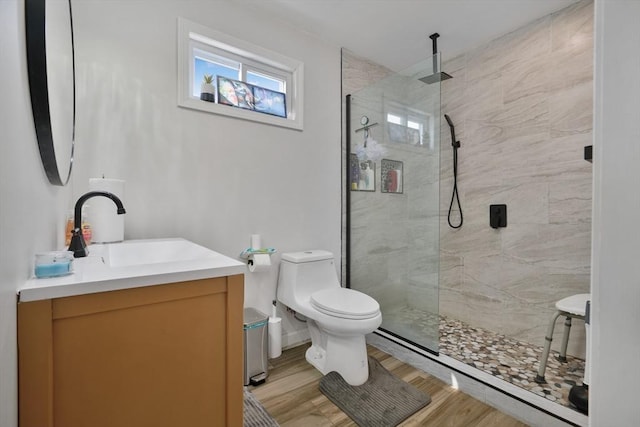 32 Slater St, Fall River, MA 02720 - bathroom featuring vanity, walk in shower, and wood finished floors