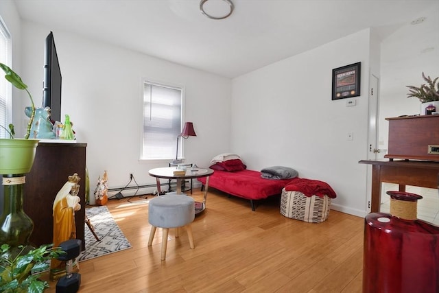 32 Slater St, Fall River, MA 02720 - sitting room featuring wood finished floors and a baseboard heating unit