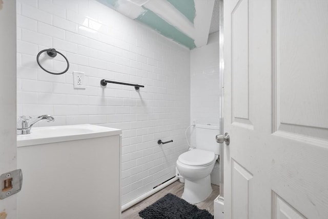 32 Slater St, Fall River, MA 02720 - bathroom featuring vanity, wood finished floors, and tile walls