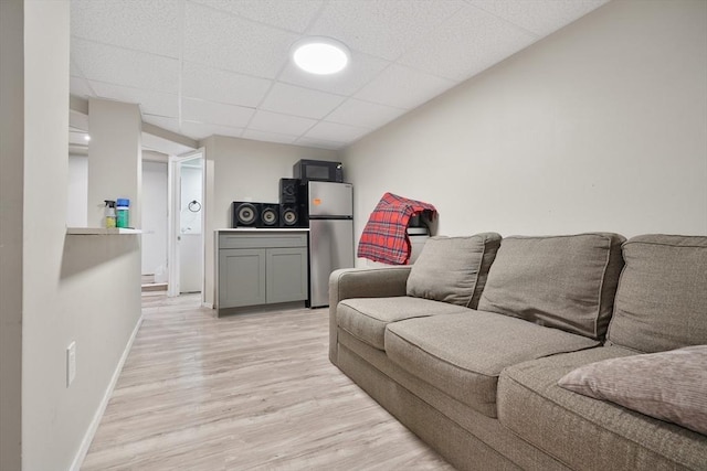 32 Slater St, Fall River, MA 02720 - living area with light wood finished floors and a paneled ceiling