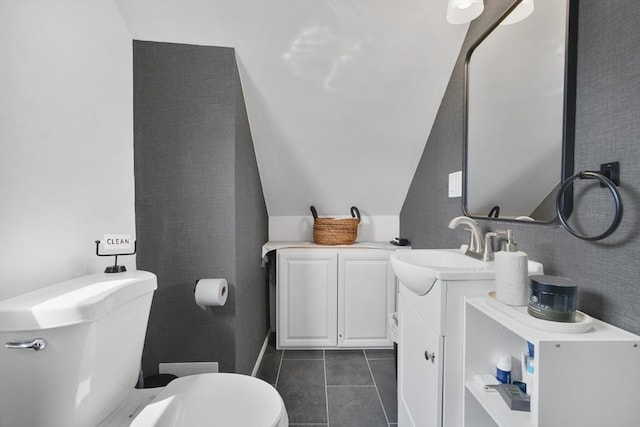 32 Slater St, Fall River, MA 02720 - bathroom featuring vanity, lofted ceiling, and tile patterned flooring