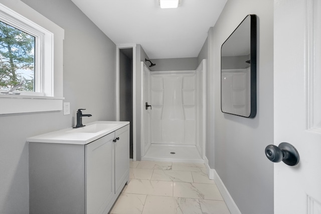 bathroom with vanity and walk in shower