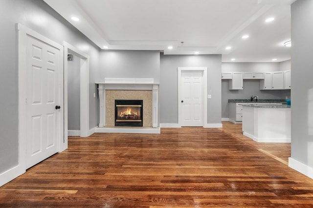 unfurnished living room featuring dark hardwood / wood-style floors