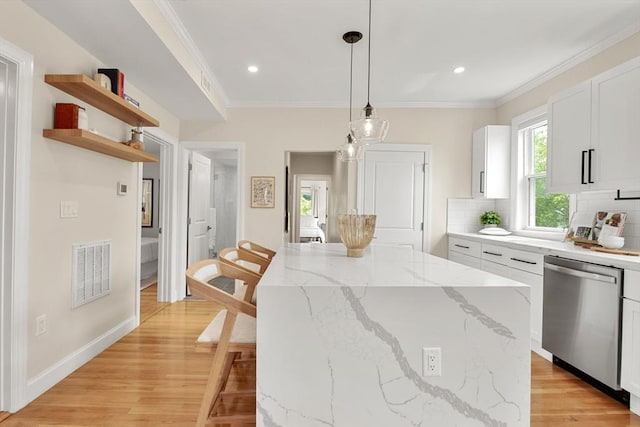 34 Leniston St Unit 2, Boston, MA 02131 - kitchen with dishwasher, white cabinetry, ornamental molding, decorative backsplash, and a center island