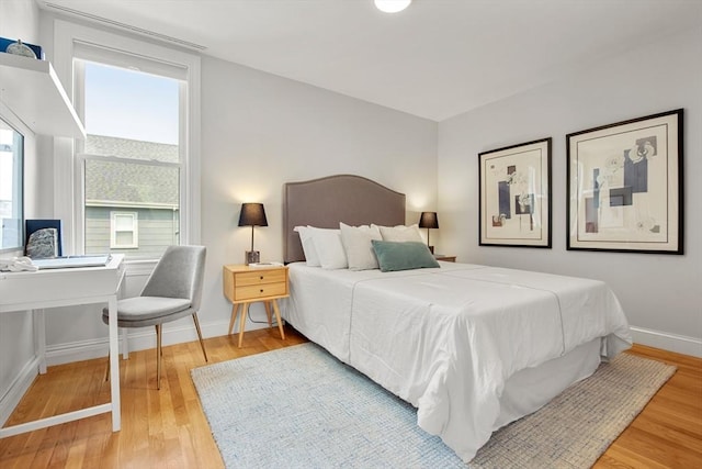 34 Leniston St Unit 2, Boston, MA 02131 - bedroom with wood finished floors, baseboards, and an office area