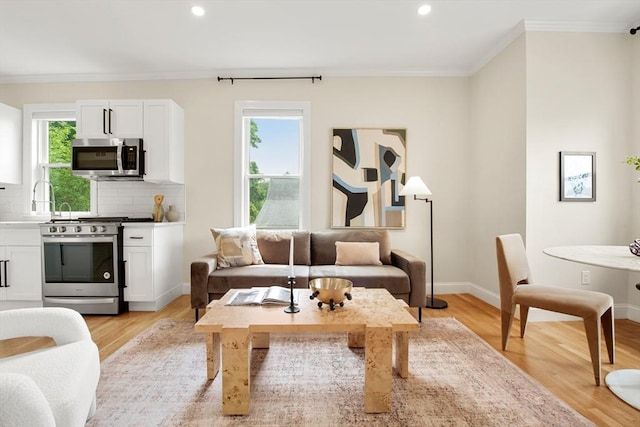34 Leniston St Unit 2, Boston, MA 02131 - living area featuring ornamental molding, light wood finished floors, recessed lighting, and baseboards