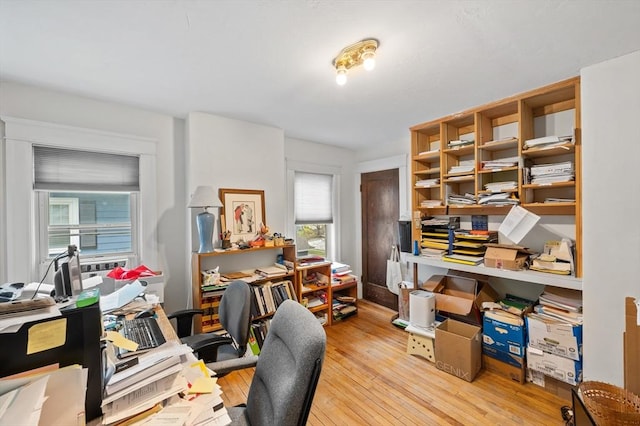 home office with hardwood / wood-style flooring