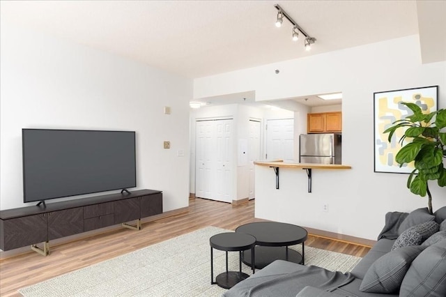 169 Monsignor Obrien Hwy Unit 206, Cambridge, MA 02141 - living area featuring track lighting and light wood-style flooring