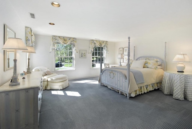 carpeted bedroom featuring visible vents, baseboards, and recessed lighting