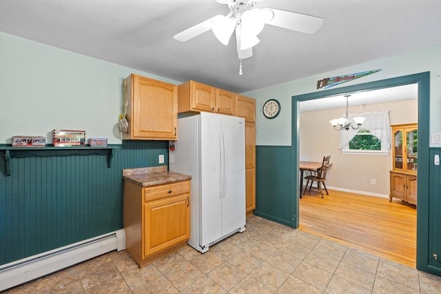 22 Edgewood Ave, West Boylston, MA 01583 - kitchen featuring baseboard heating, freestanding refrigerator, a chandelier, a wainscoted wall, and ceiling fan