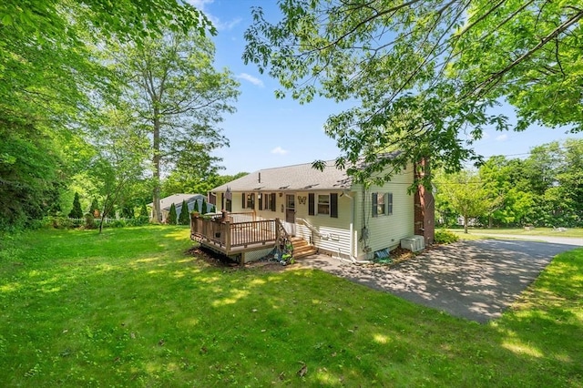 22 Edgewood Ave, West Boylston, MA 01583 - back of house featuring a wooden deck and a lawn