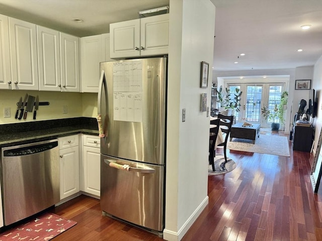 300 Allston St Unit 511, Boston, MA 02135 - kitchen featuring appliances with stainless steel finishes, dark wood finished floors, white cabinets, recessed lighting, and open floor plan