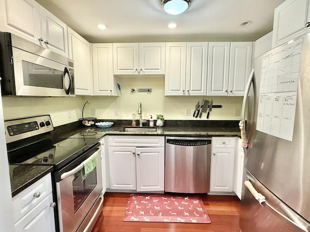 300 Allston St Unit 511, Boston, MA 02135 - kitchen with stainless steel appliances, a sink, white cabinets, and recessed lighting