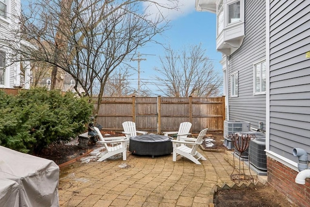 view of patio / terrace featuring cooling unit and fence