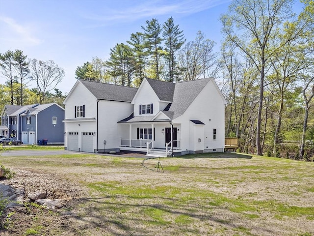 310 Old Westport, Dartmouth, MA 02747 - modern farmhouse style home with an attached garage, asphalt driveway, a front lawn, and covered porch