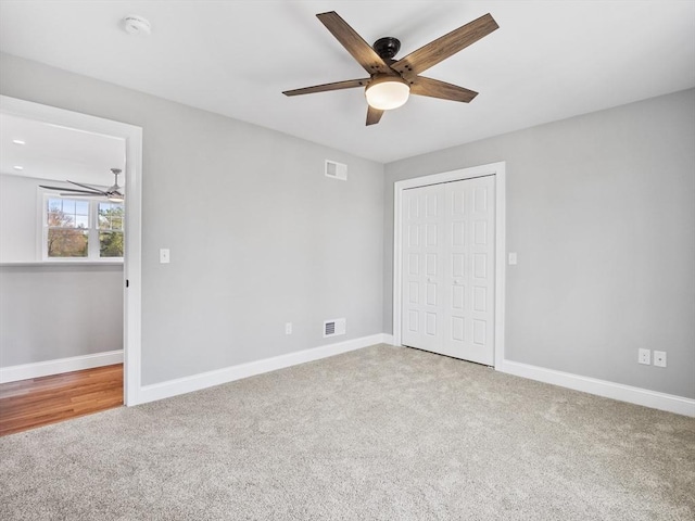 310 Old Westport, Dartmouth, MA 02747 - unfurnished bedroom with carpet flooring, a closet, and baseboards