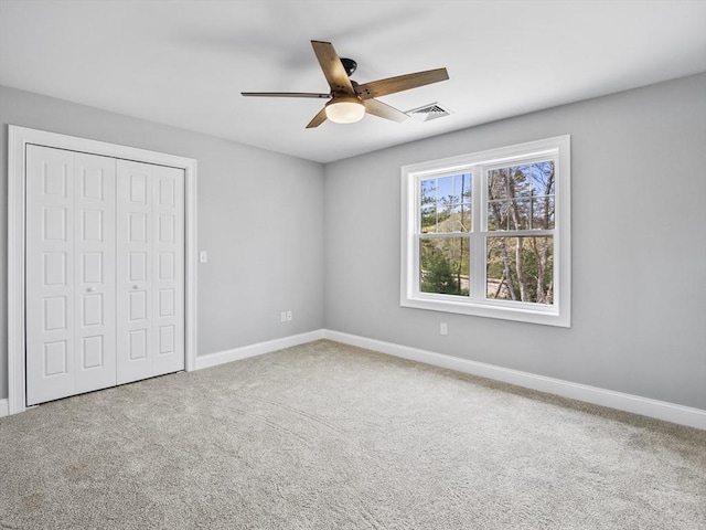310 Old Westport, Dartmouth, MA 02747 - unfurnished bedroom with a closet, baseboards, carpet, and ceiling fan