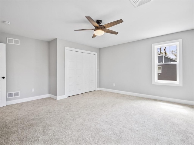 310 Old Westport, Dartmouth, MA 02747 - unfurnished bedroom featuring carpet floors, baseboards, a closet, and a ceiling fan
