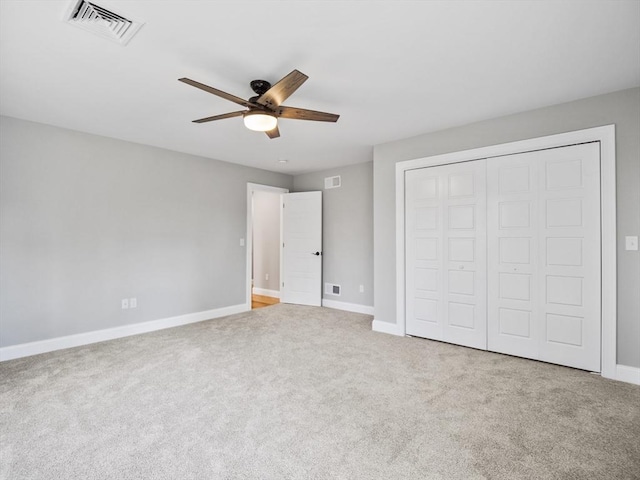 310 Old Westport, Dartmouth, MA 02747 - unfurnished bedroom featuring baseboards, carpet, a closet, and a ceiling fan