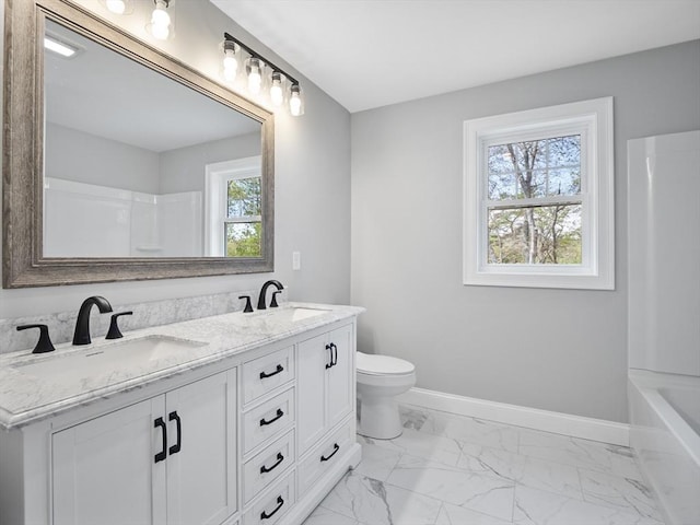310 Old Westport, Dartmouth, MA 02747 - bathroom with double vanity, toilet, baseboards, marble finish floors, and bathtub / shower combination