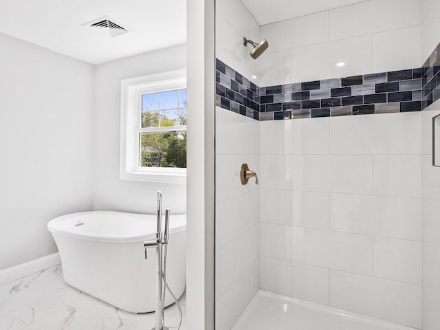 310 Old Westport, Dartmouth, MA 02747 - bathroom featuring marble finish floors, tiled shower, a freestanding bath, and baseboards