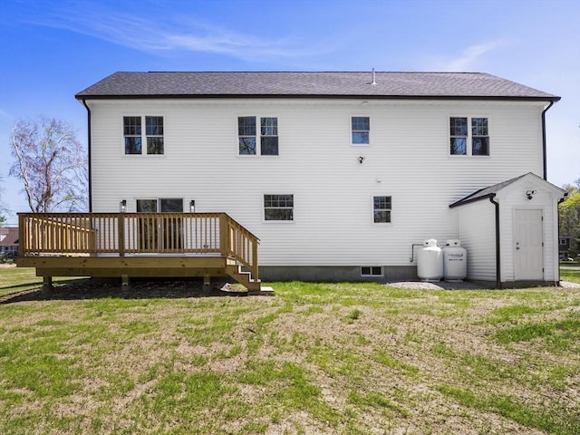 310 Old Westport, Dartmouth, MA 02747 - rear view of house featuring a deck and a lawn