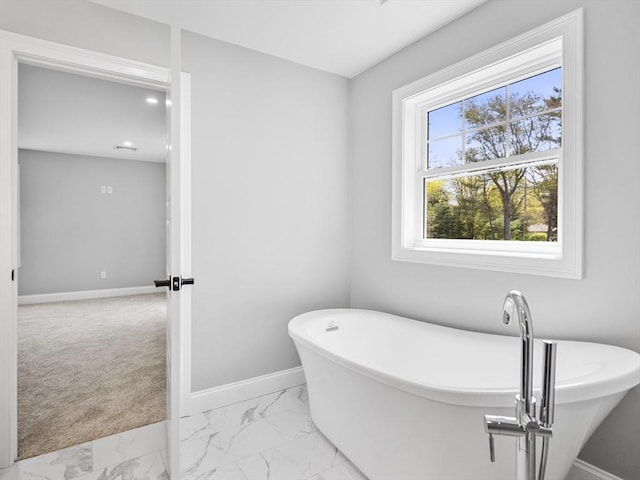 310 Old Westport, Dartmouth, MA 02747 - bathroom with marble finish flooring, a soaking tub, baseboards, and recessed lighting