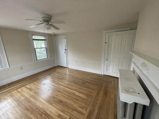 20 Cross St, Salem, MA 01970 - unfurnished living room with ceiling fan and wood finished floors