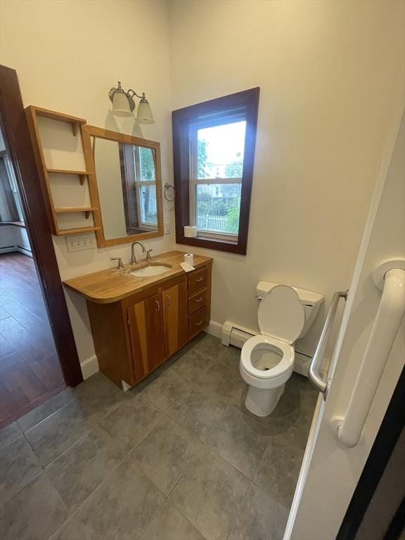 20 Cross St, Salem, MA 01970 - bathroom with a baseboard heating unit, vanity, and tile patterned floors