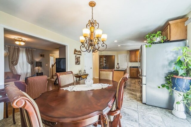 dining space with an inviting chandelier and recessed lighting