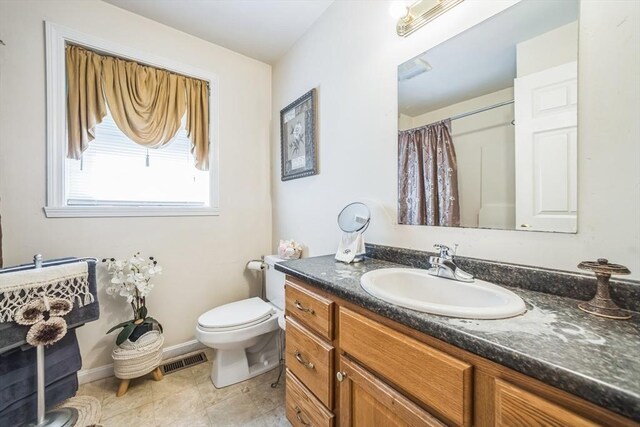 full bathroom with visible vents, vanity, toilet, a shower with shower curtain, and tile patterned floors