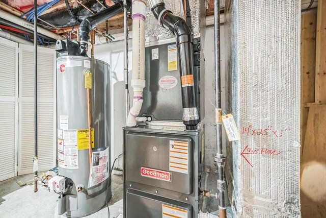 utility room featuring gas water heater