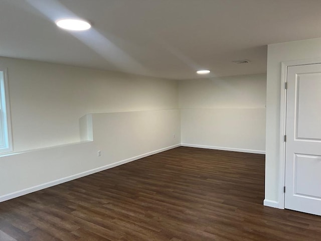 unfurnished room with dark hardwood / wood-style floors